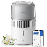 Philips smart air humidifier and aroma diffuser shown with mobile app control and fresh white flowers