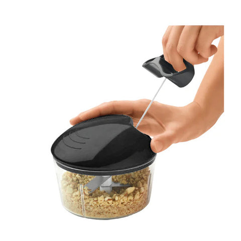 Anex AG-01 Deluxe Handy Pull Chopper showing its clear container, pull cord lid, and stainless steel blades inside