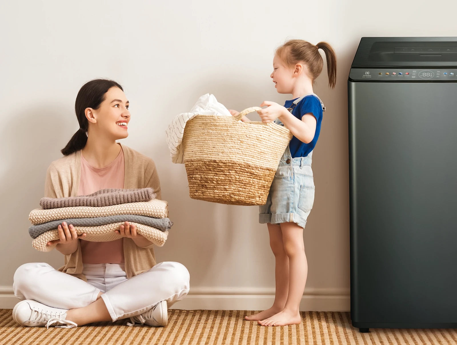 Electrolux ELWM-TL100 G INV Top Load Inverter Fully Automatic Washing Machine - Metal Blue - family laundry lifestyle view