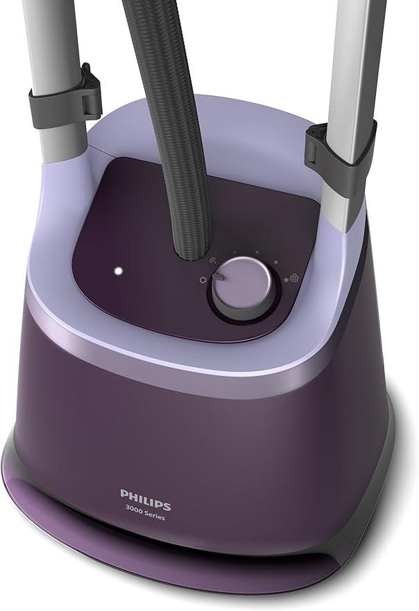 Close-up view of Philips garment steamer purple base heating unit and control dial